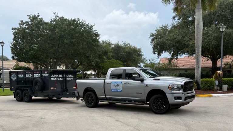 High Caliber Junk Removal truck and trailer parked in a residential neighborhood in Pompano Beach