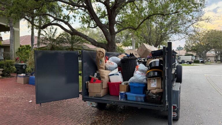 Dump trailer fully loaded with household items during a residential cleanout