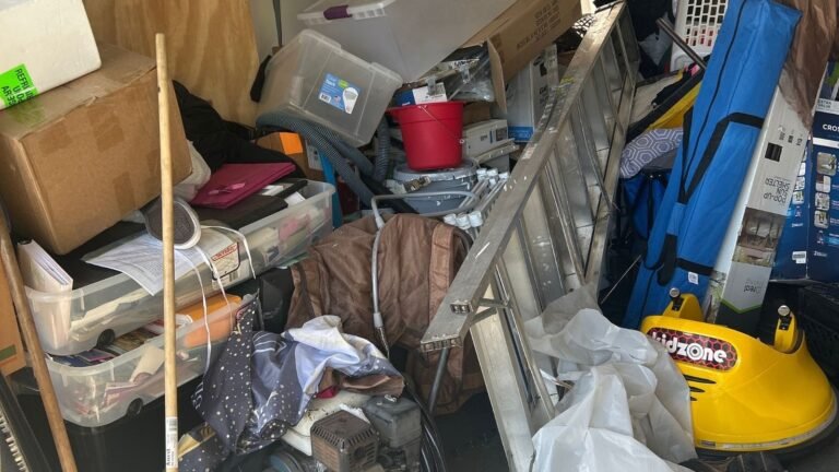 Cluttered garage before junk removal cleanout